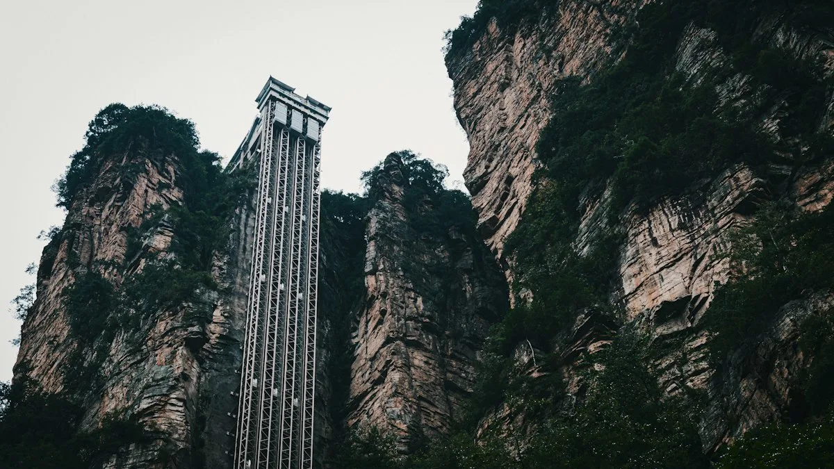 The Bailong Elevator climbing a sheer sandstone cliff inside Zhangjiajie National Forest Park, with forested karst pillars on either side