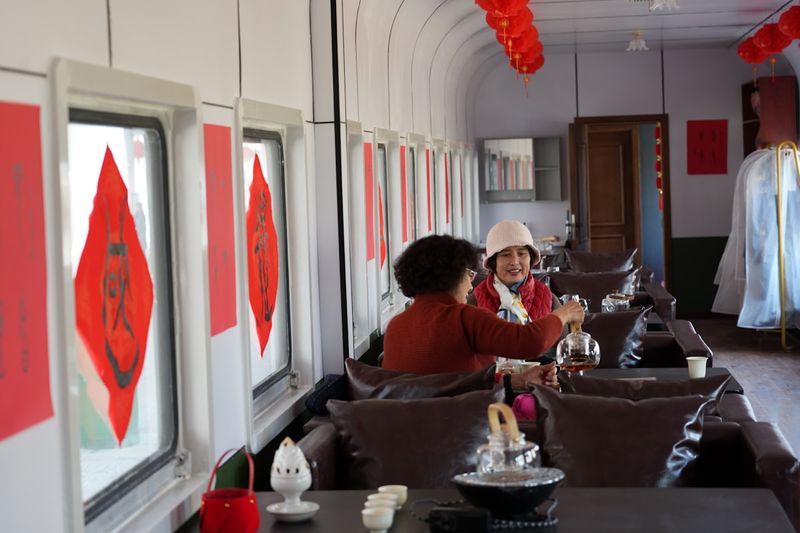 Inside a China high-speed train — second class seats with power outlets and tray tables