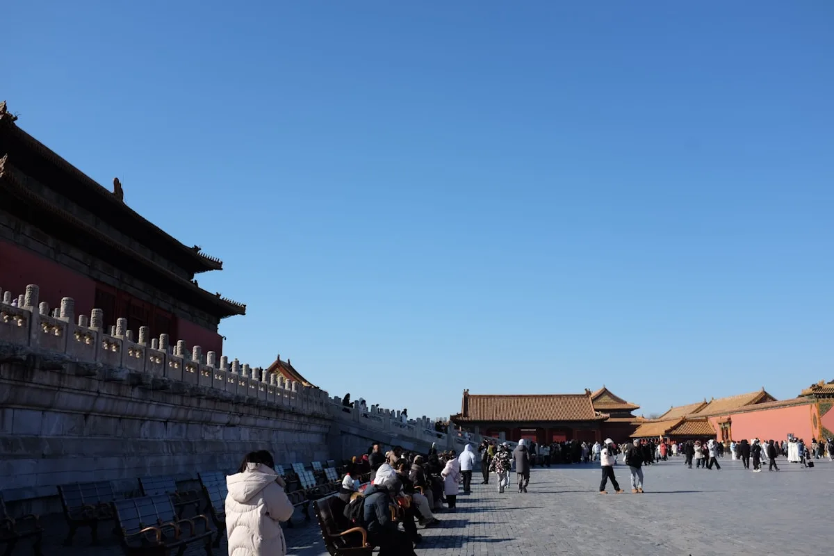 Tourists crossing the marble bridge toward the Forbidden City's Meridian Gate, within a short walk of most Wangfujing hotels
