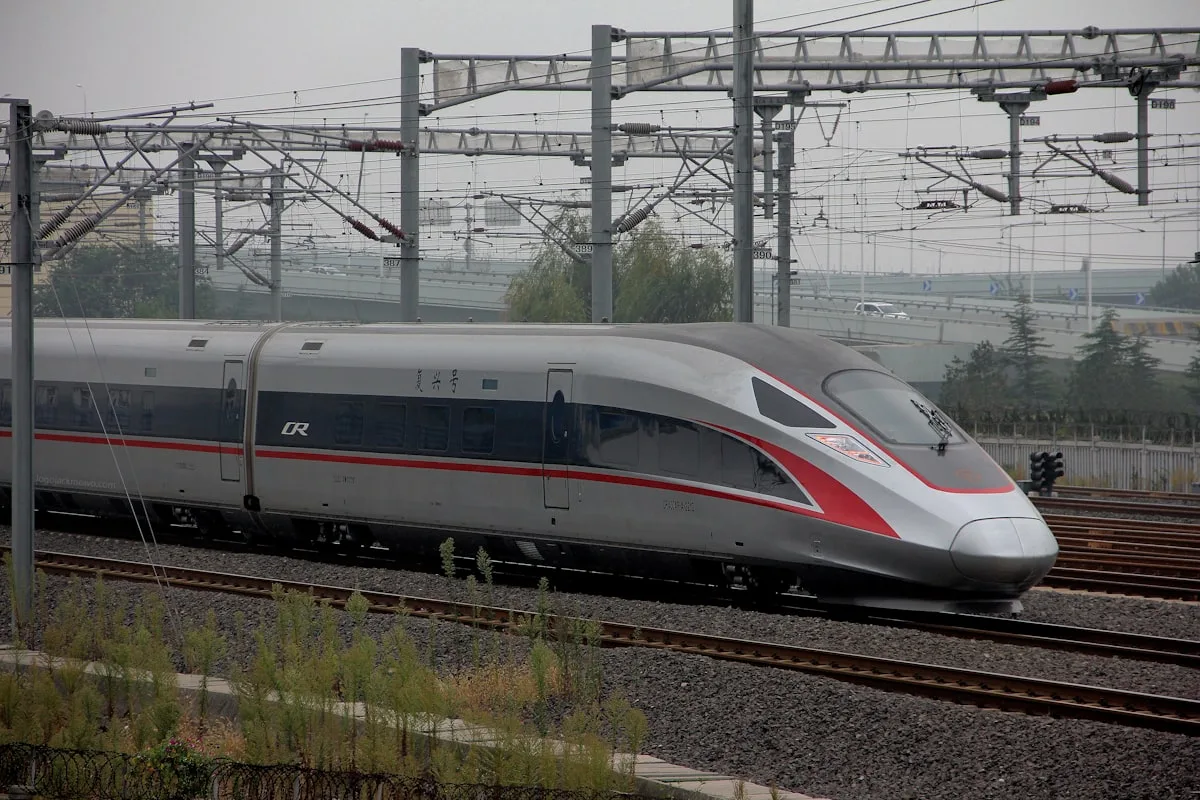 A China Fuxing high-speed train running along electrified track