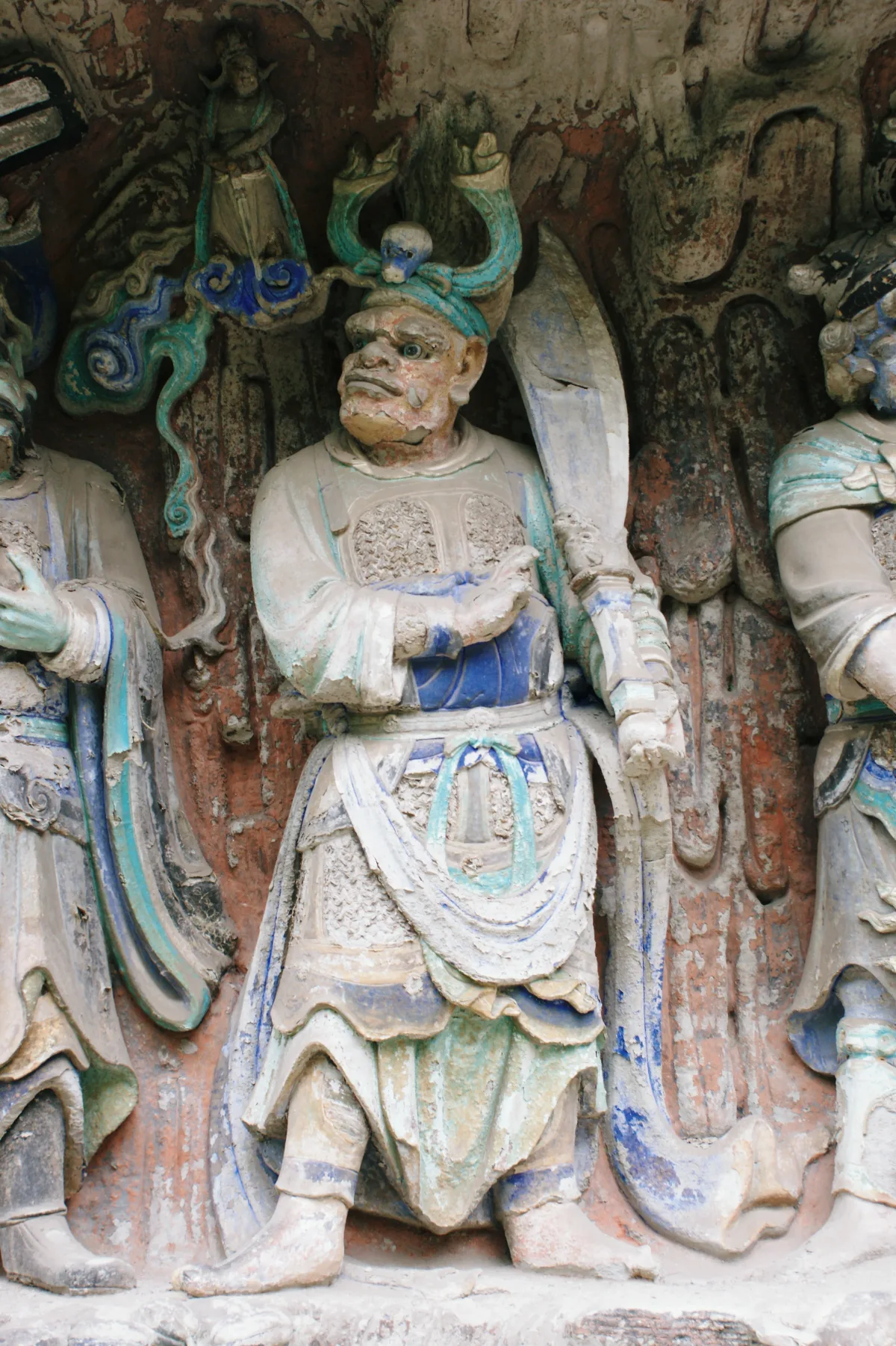 Painted guardian deity reliefs carved into the Baodingshan cliff at Dazu, one of the 10,000 figures at the main site (Photo: Hugh Llewelyn via Wikimedia Commons)