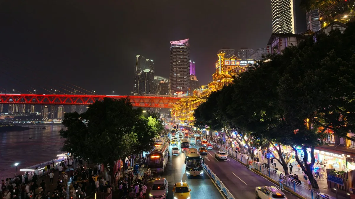 Chongqing at night seen across the Yangtze, hillside buildings and riverside towers glowing along the waterfront