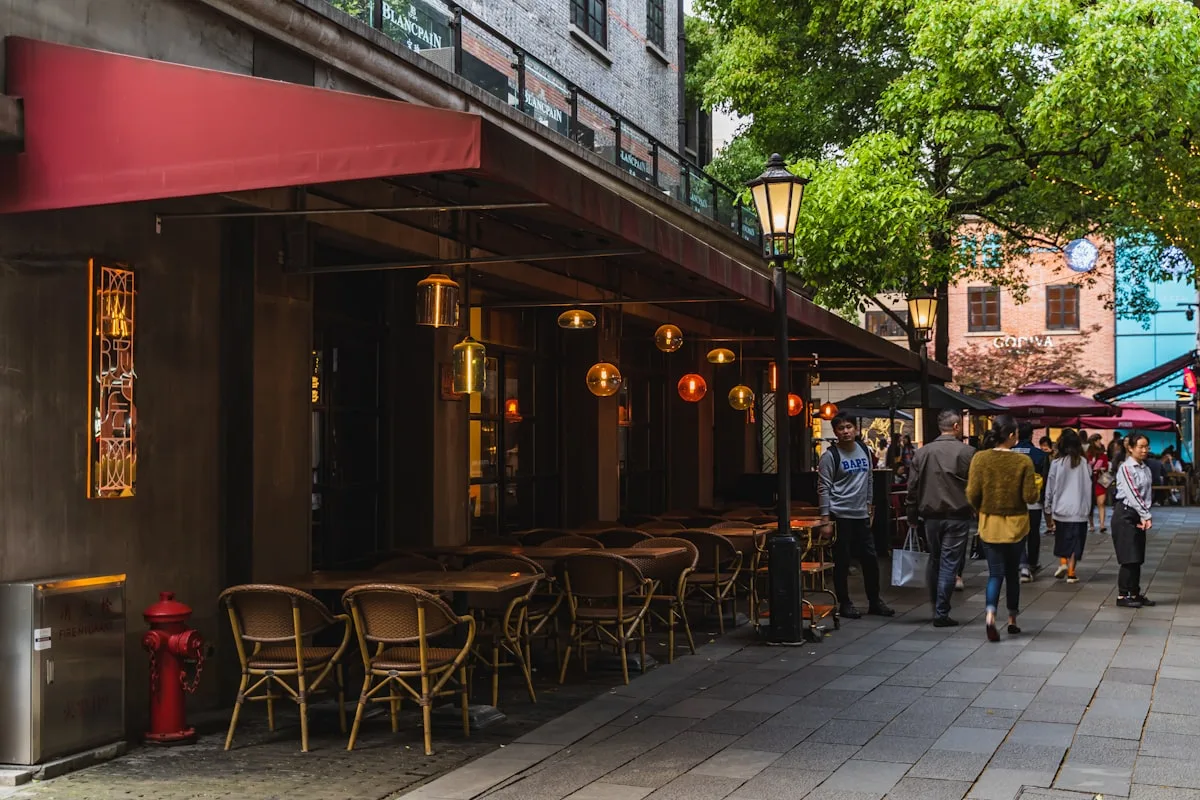 Café seating outside restored shikumen buildings in Shanghai's Xintiandi, the pedestrian precinct known for nightlife and dining