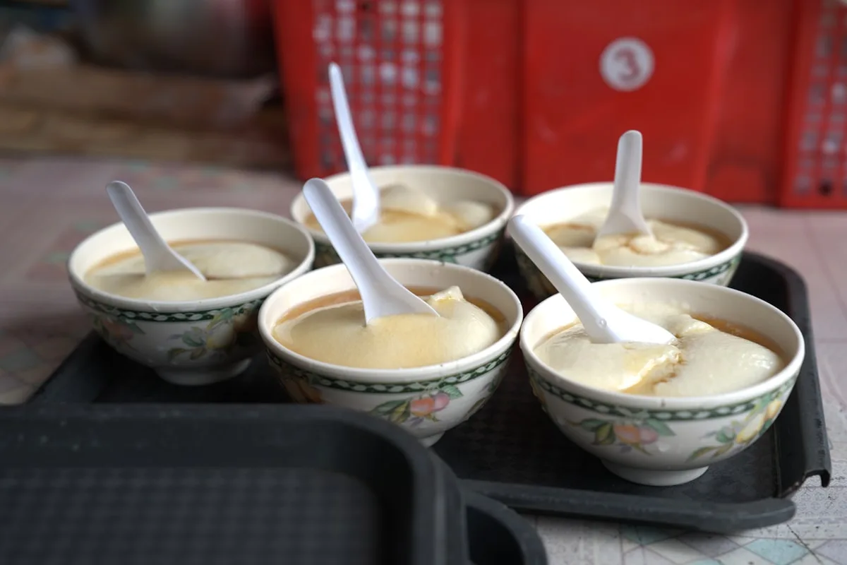 Chinese tofu pudding desserts served in ceramic bowls