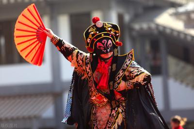Traditional Sichuan opera performer with face-changing mask