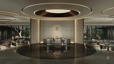 Modern hotel lobby with reception desk and seating areas