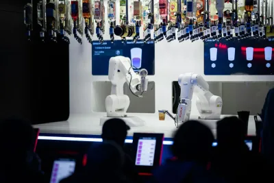 Robotic arms mixing cocktails at a bar