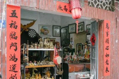 A storefront filled with handicrafts, bags, and accessories on display