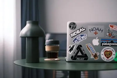 Laptop on desk in modern workspace with natural light, China remote work setup