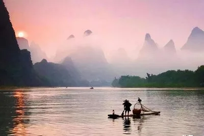 Karst mountains and bamboo rafts on the Yulong River in Yangshuo