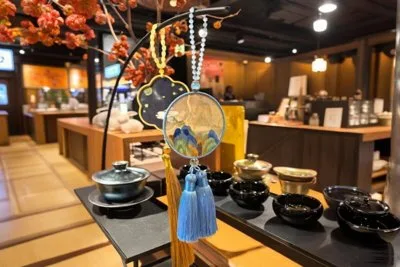 Colorful traditional items and souvenirs hanging on display in a Suzhou shop