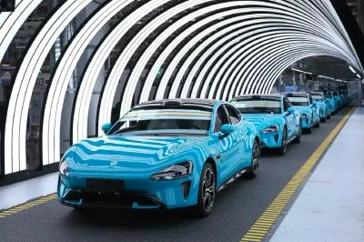 Xiaomi EV cars lined up to leave the factory